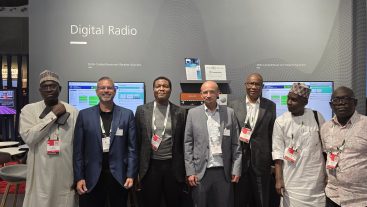 A Nigerian delegation exploring DRM technologies at the Fraunhofer booth.